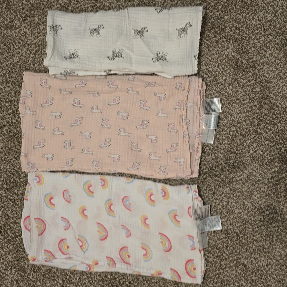 2 Aden + Anais Muslin Swaddle Blankets and 1 Amazon Basics Muslin Swaddle